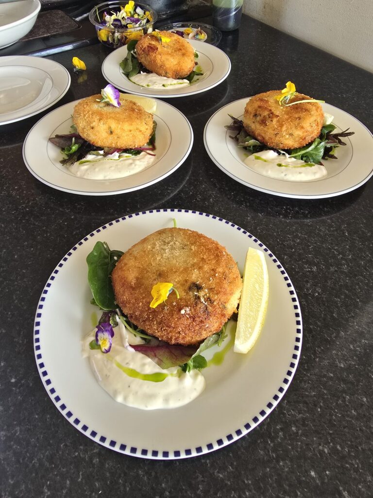 Fishcakes with garnish, private chef plating by Meals with Chef